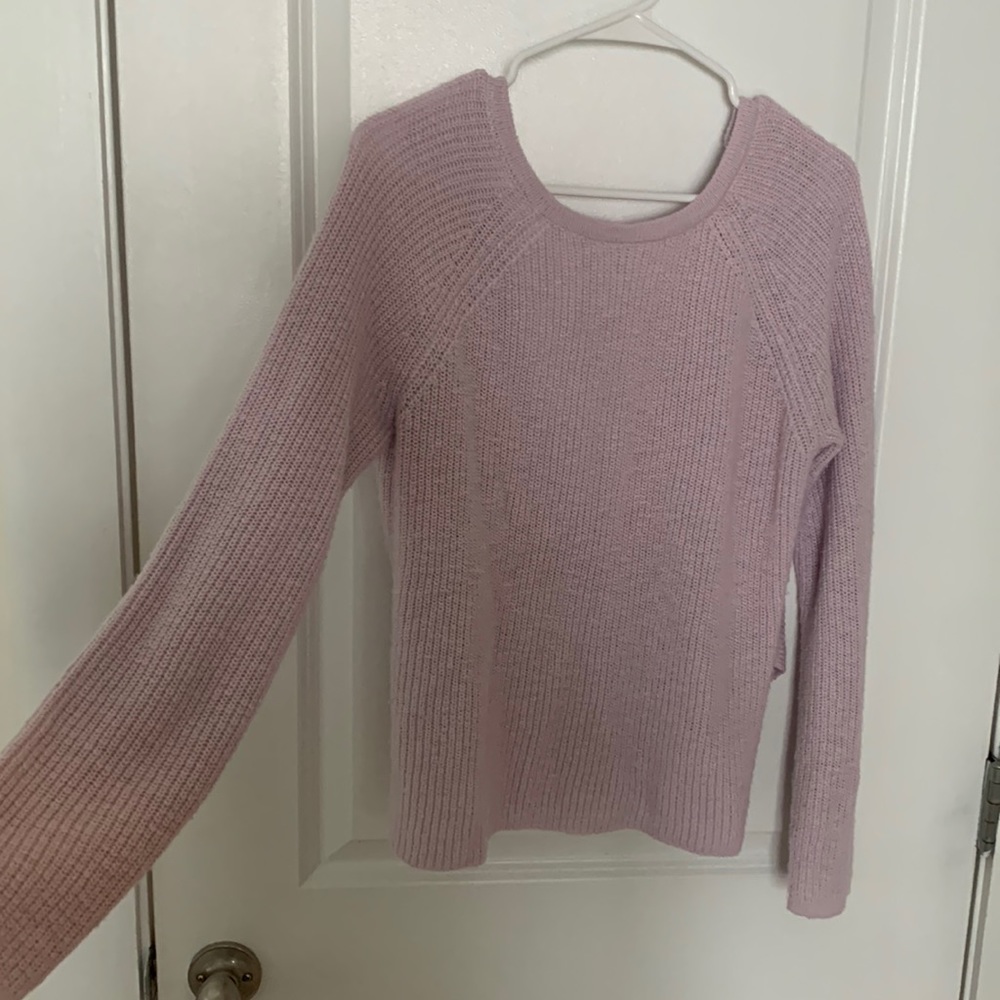 Soft loose knit American eagle sweater. Open back with low draping.